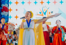 SETAR ORGUYOSO DI POR CONTRIBUI NA E FESTIVAL UN CANTO PA ARUBA SU HIMNO Y BANDERA