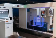 AEROPUERTO DI ARUBA TA INTRODUCI “SELF BAG DROP” DEN E SALA DI CHECK-IN PA MERCA